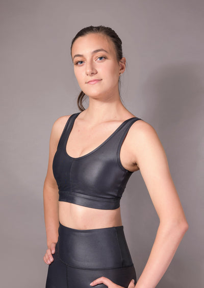 Liquid bra in black - YUCO Designed to be sculpting and ultra-flattering, the liquid bra in black is a medium support sports bra in our signature liquid finish. It pairs seamlessly with our best-selling liquid leggings.
